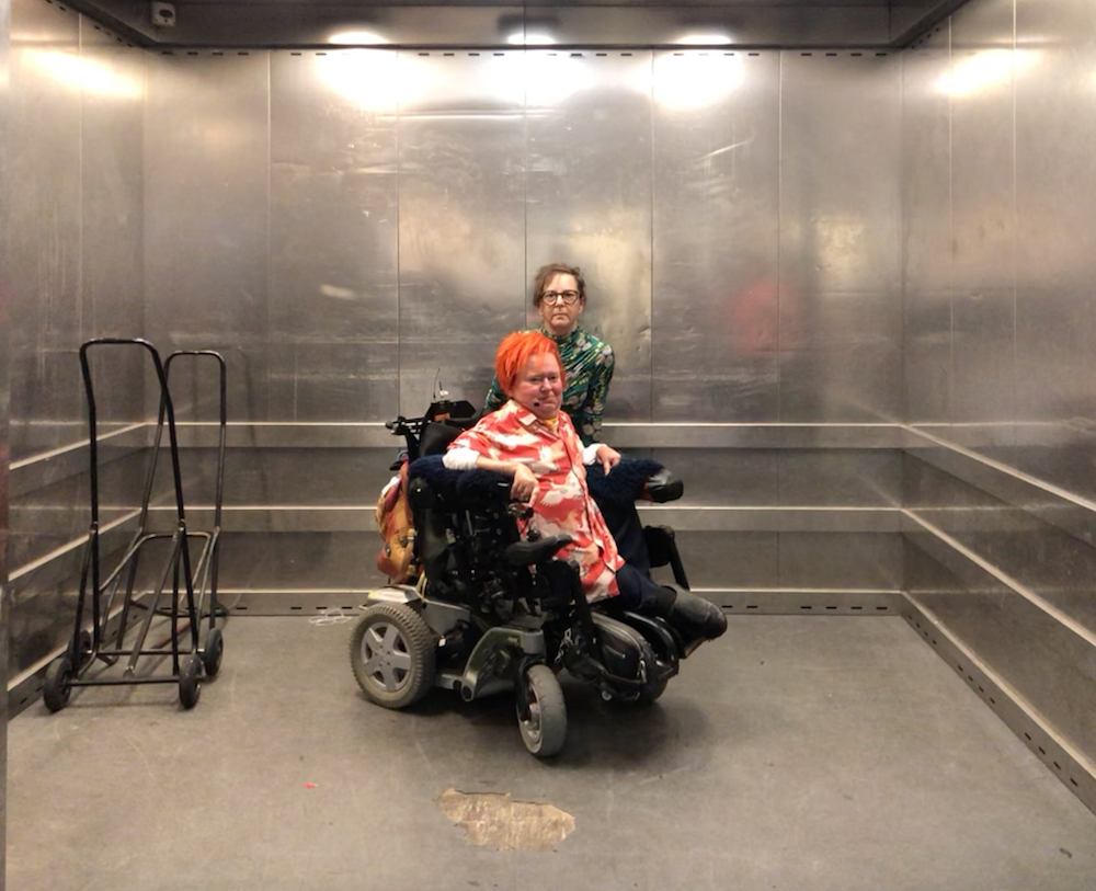 The artists are in a elevator.